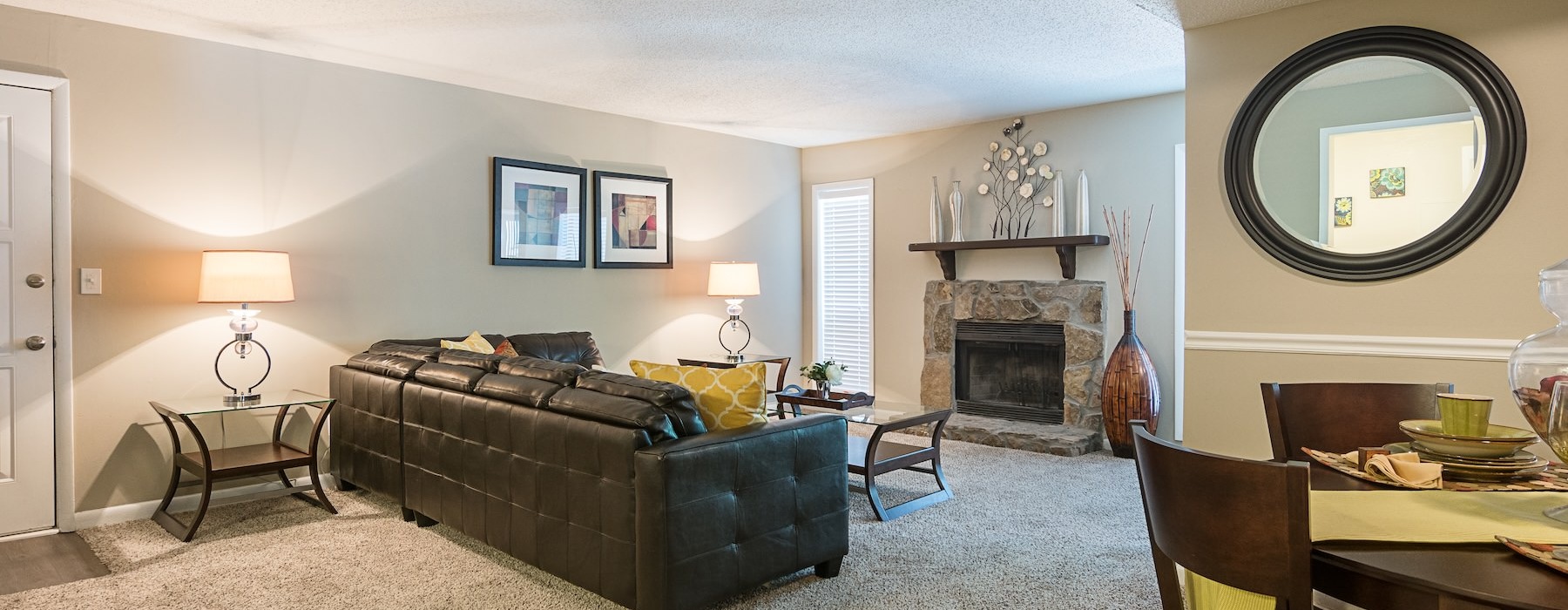 a living room with a fireplace and couch