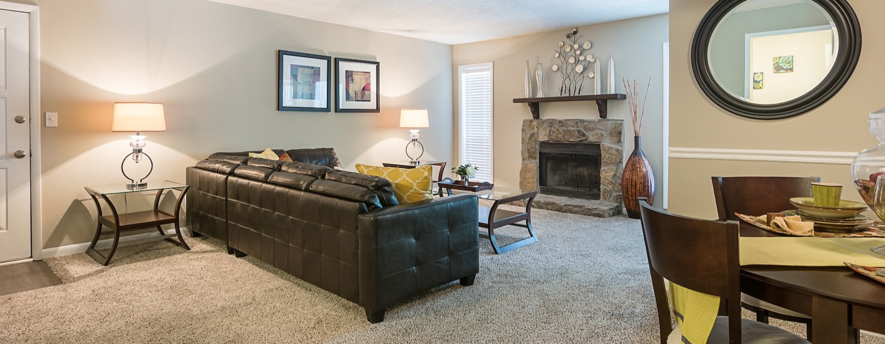 a living room with a fireplace and couch