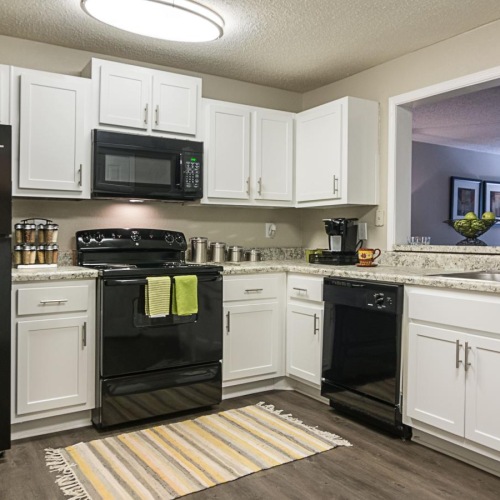 a kitchen with white cabinets